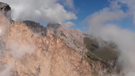 Aerial-photography-group-of-climbers-working-with-a-rope.-Rescue-work-climbing-to-the-top-of-the-mountain.