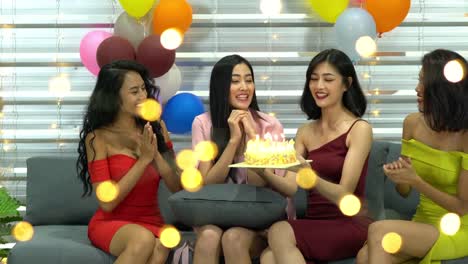 Beautiful-chinese-woman-celebration-happy-birthday-with-friends-and-cake-together.-Concept-of-festival,-birthday,-happy-new-year-and-christmas.-4k-resolution.