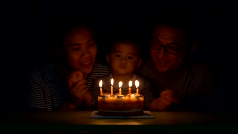 Happy-family-celebrating-child's-birthday,-Father-and-Mother-kissing-son-on-his-birthday