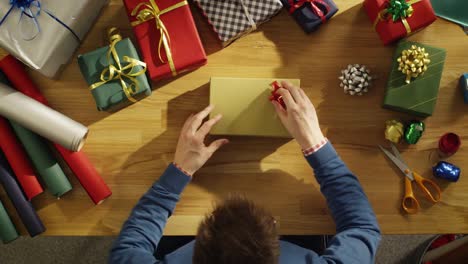 Top-View-of-a-Man-Closing-Beautiful-Gift-Box.-Box-Interior-is-Mock-up-Green-Screen.