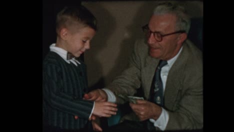 Grandfather-gives-grandson-money-and-kisses-him