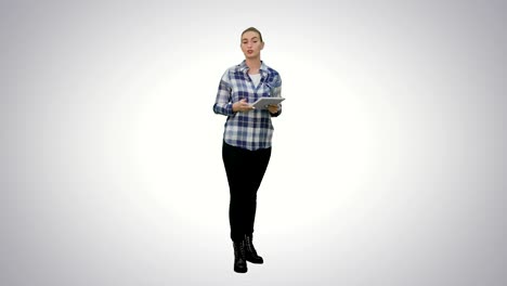 Young-woman-using-reading-presentation-from-a-tablet-on-white-background