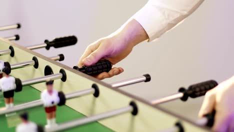 4K- People-play-table-football.