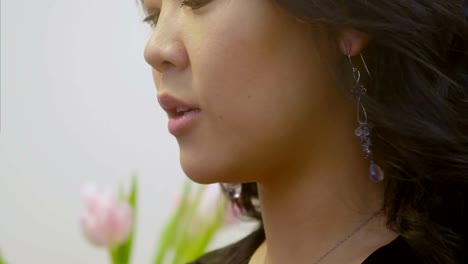 Attractive-brunette-tries-on-an-earring-and-talking