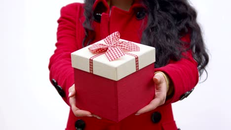 A-box-with-a-gift-in-the-hands-of-a-woman