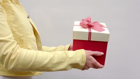 A-girl-holds-out-a-gift-from-right-to-left