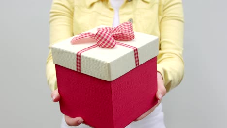 Close-up-of-a-gift-in-hands.