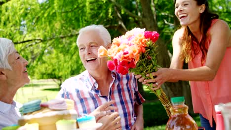 Family-celebrating-birthday-party-in-the-park