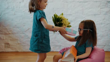 lovely-sisters-give-themselves-flowers-and-a-gift