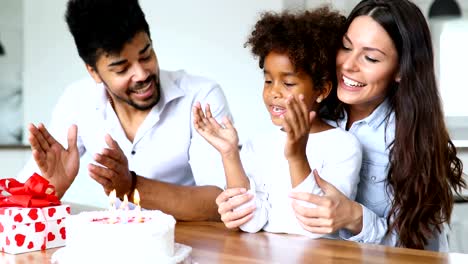 Happy-family-celebrating-birthday-of-their-child