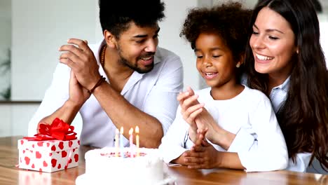 Happy-family-celebrating-birthday-of-their-child