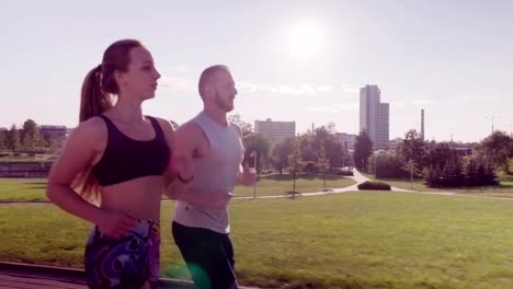 man-and-woman-running-in-city-park