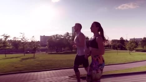 man-and-woman-running-in-city-park