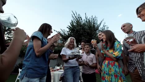 Woman-blowing-candles-on-party