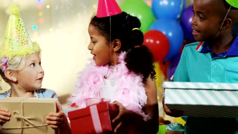 Kids-holding-gift-boxes-during-birthday-party-4k