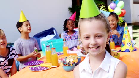 Girl-standing-with-the-friends-in-the-backyard-of-house-4k