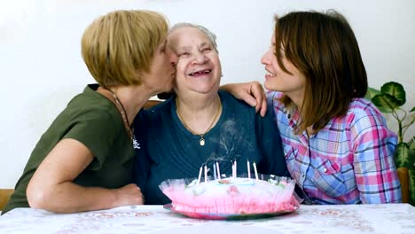 Happy-Grandmother's-birthday,-daughter-and-grandaughter-celebrating-her