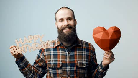 Hipster-man-showing-and-giving-you-a-Happy-Birthday-text