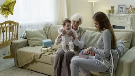 Woman-Opening-Presents-for-Baby