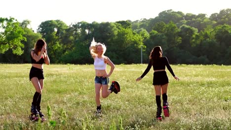 Group-training-kangoo.-Three-girls-at-sunset-in-the-Park-doing-fitness