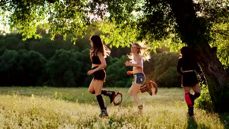 Group-training-kangoo.-Three-girls-at-sunset-perform-dynamic-exercises-aimed-at-weight-loss-and-muscle-strengthening