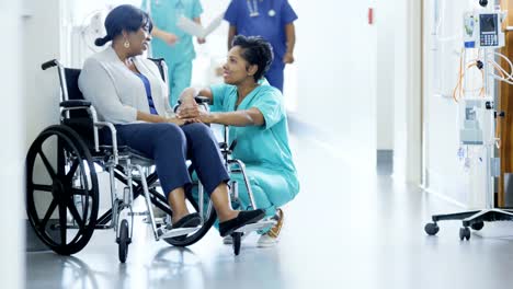 African-American-female-staff-and-disabled-patient-consult