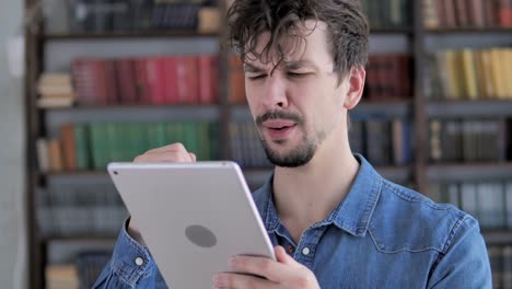 Sad-Casual-Young-Man-in-Awe-for-Losing-Online-on-Tablet