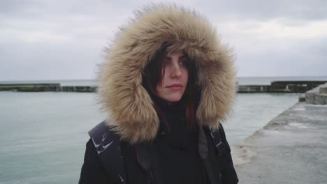 Closeup-portrait-of-a-young-beautiful-red-haired-woman-outdoors.-Girl-in-a-warm-fluffy-jacket