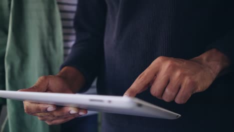 Close-up-of-a-man's-hand-using-digital-tablet