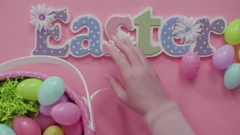 Easter-basket-with-easter-eggs-on-a-pink-background.