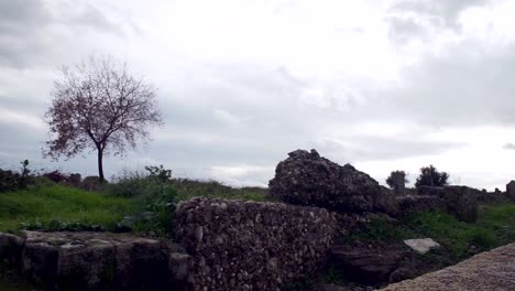 ancient-walls-of-treated-stones-rocky-steps-leading-downward