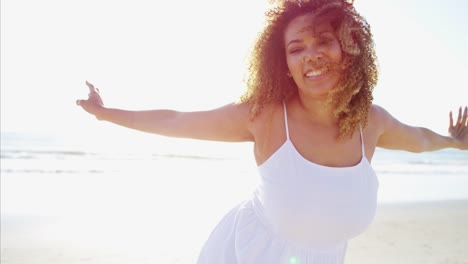 Portrait-of-African-American-female-relaxing-by-ocean