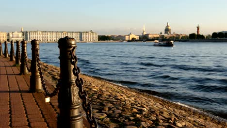 Iron-columns-on-an-embankment-of-the-Neva-river-in-the-summer---St.-Petersburg,-Russia