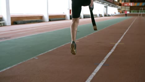 Unrecognizable-Man-with-Prosthetic-Leg-Training-on-Track