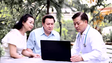 Doctor-and-patient-discussing-medical-examination-outdoor-in-garden.