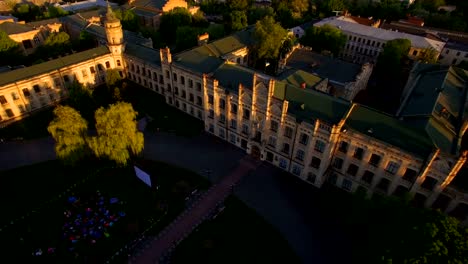 Old-colledge-on-the-background-of-the-city-at-sunset-aerial