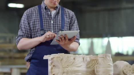 Carpenter-Working-on-Tablet