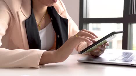 Closeup-hand-touching-screen-smartphone.-She-use-smartphone-shopping-online-and-payments.