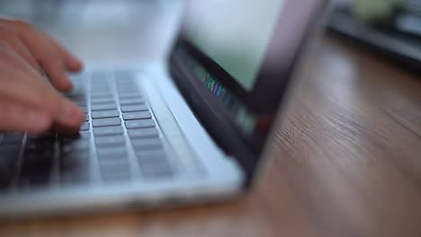 Hands-typing-on-computer-keyboard,-close-up