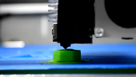 3D-printer-prints-green-shape-of-plastic-layers