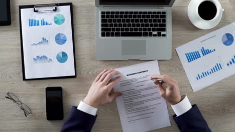 Man-reading-business-contract,-spinning-pen-and-thinking-about-its-conditions