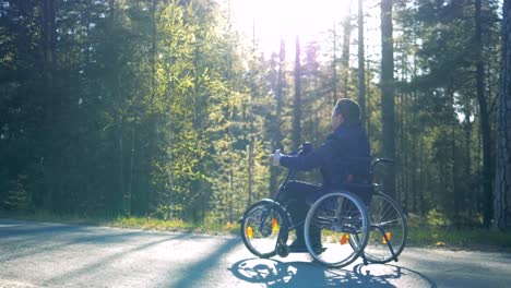 Slow-motion-process-of-a-physically-challenged-man-in-a-training-wheelchair