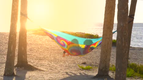 Romantic-lesbian-couple-relaxing-in-hammock