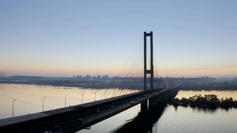 Kyiv-City-Bridge-Aerial-With-City-Traffic-at-Sunset