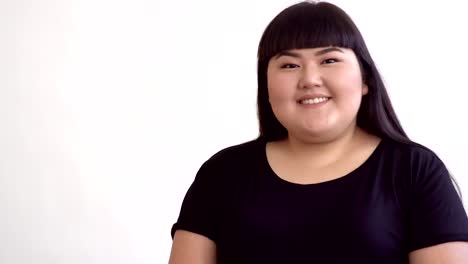 young-beautiful-overweight-Asian-girl-on-white-background-smiling.-Happy-Authentic-woman