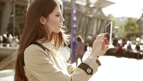 Pretty-Caucasian-woman-communicating-by-sending-text-messages-on-digital-tablet