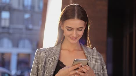 Beautiful-Business-Woman-Using-Mobile-Phone-Outdoor-On-Sunny-Day