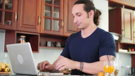 Man-Using-Gadgets-in-Kitchen