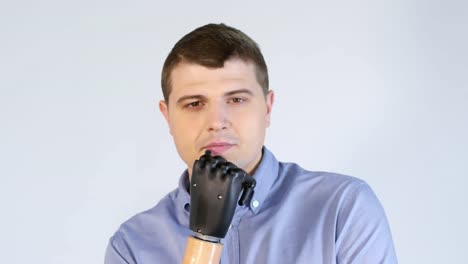 Pensive-Man-with-Prosthetic-Arm