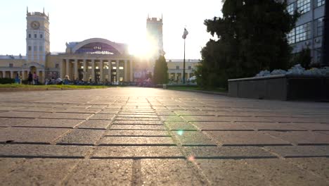 Camera-moving-through-scenic-urban-street-with-bright-sunlight-at-background.-View-of-empty-city-alley-at-sunset-time.-Point-of-view.-Slow-motion